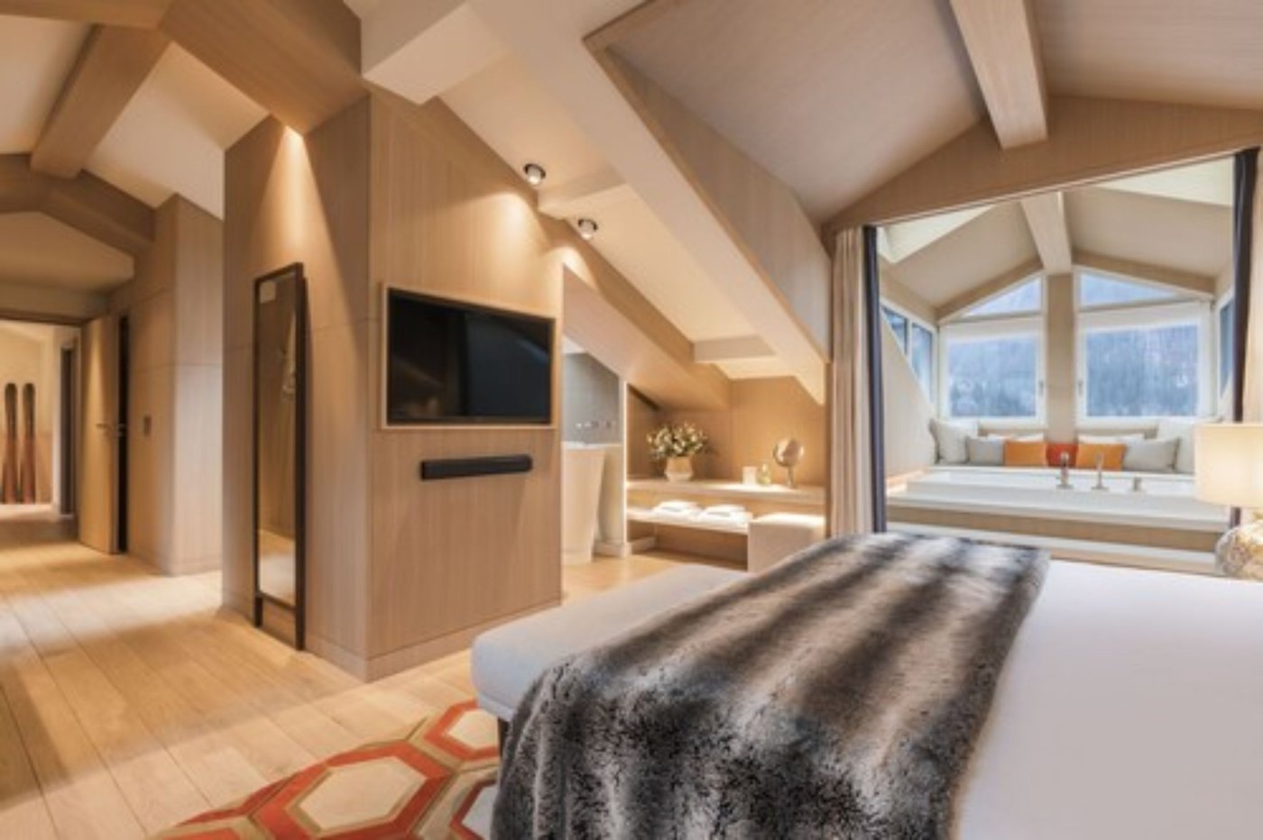 Hotel Mont-Blanc guest room with a large bed, television and bathroom