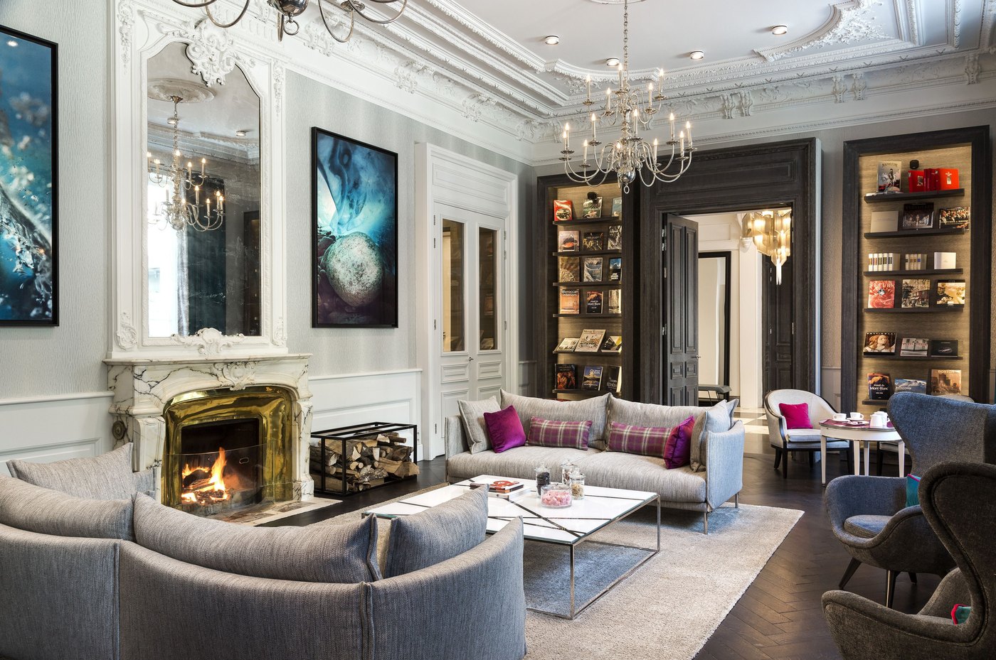 Hotel Mont-Blanc lounge with fireplace, seating and bookcase